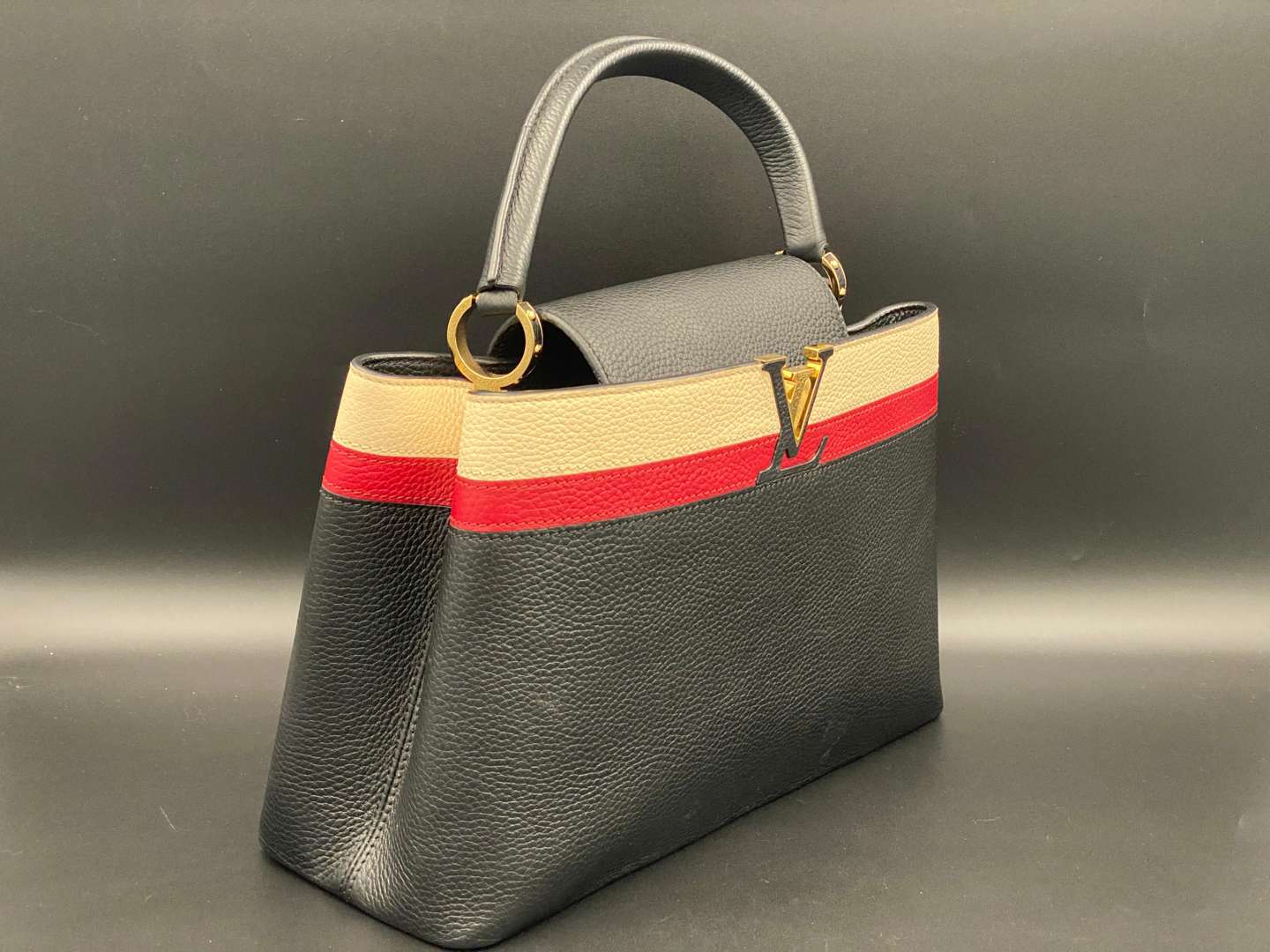 <p>LOUIS VUITTON, Capucine, tri-colour leather handbag and purse,</p>