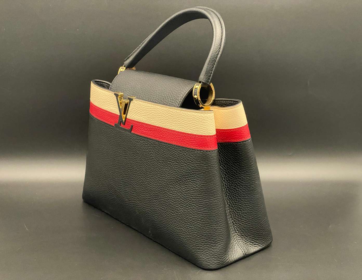 <p>LOUIS VUITTON, Capucine, tri-colour leather handbag and purse,</p>