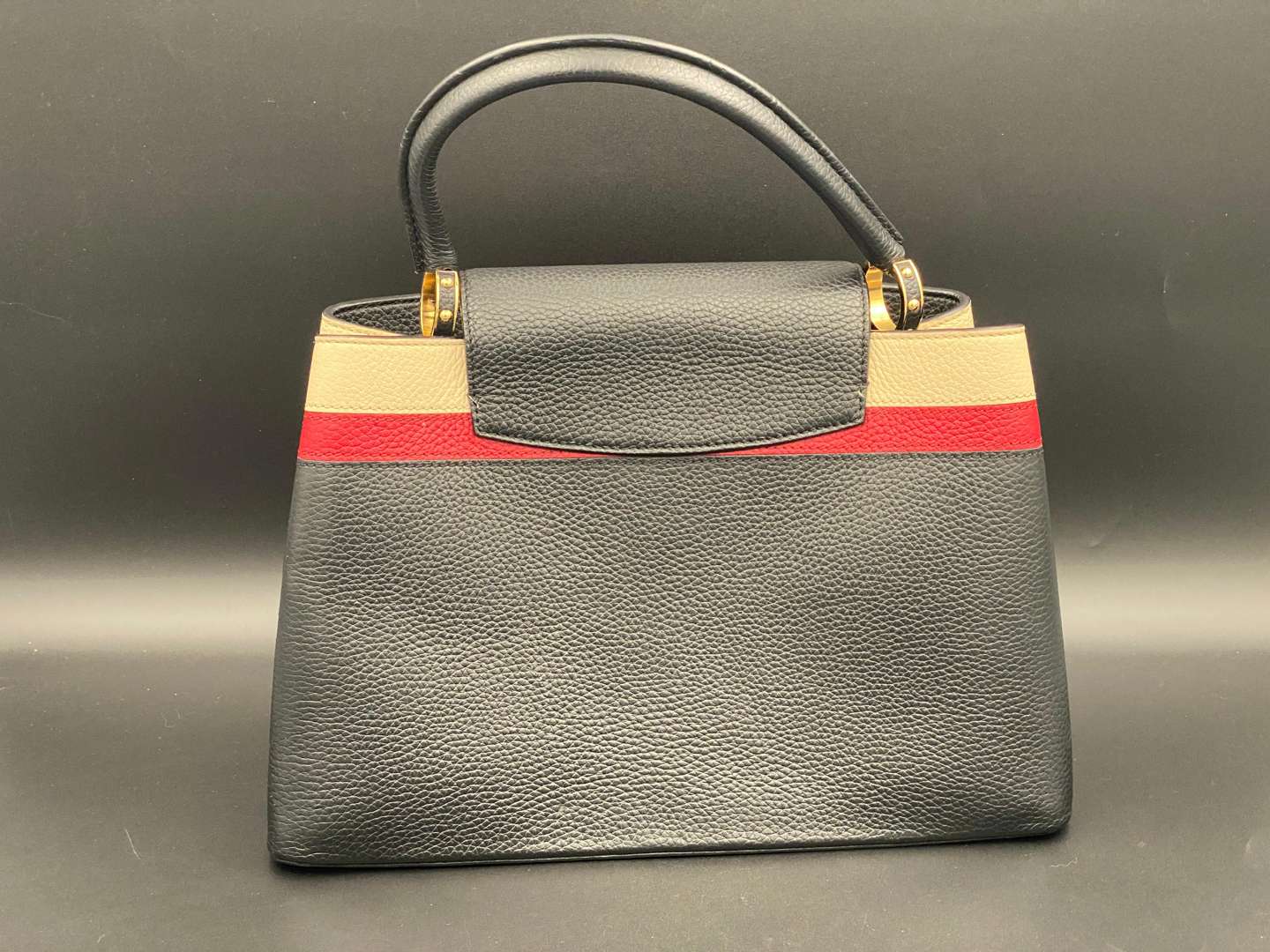<p>LOUIS VUITTON, Capucine, tri-colour leather handbag and purse,</p>