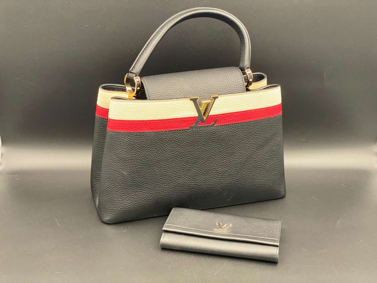 <p>LOUIS VUITTON, Capucine, tri-colour leather handbag and purse,</p>