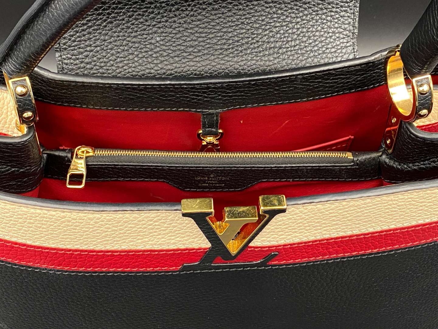 <p>LOUIS VUITTON, Capucine, tri-colour leather handbag and purse,</p>