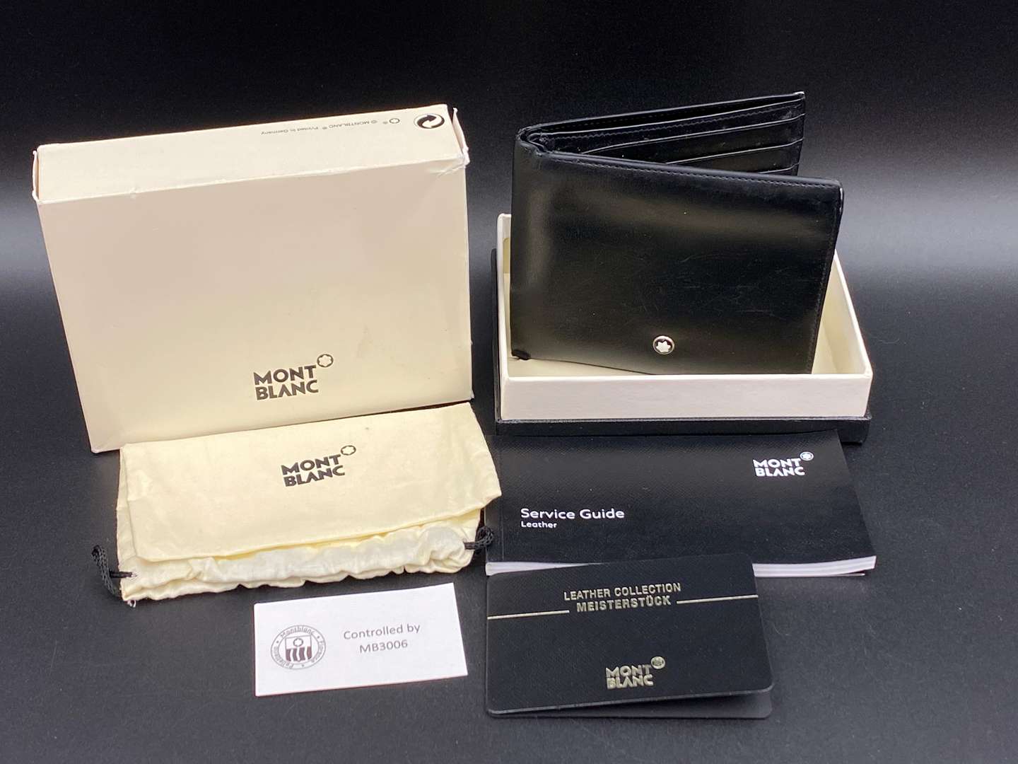 <p>MONT BLANC, a black leather wallet,</p>
