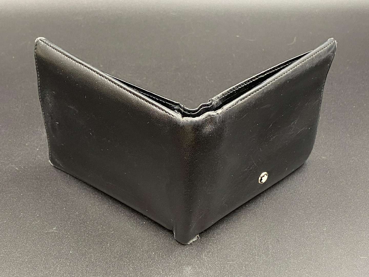 <p>MONT BLANC, a black leather wallet,</p>