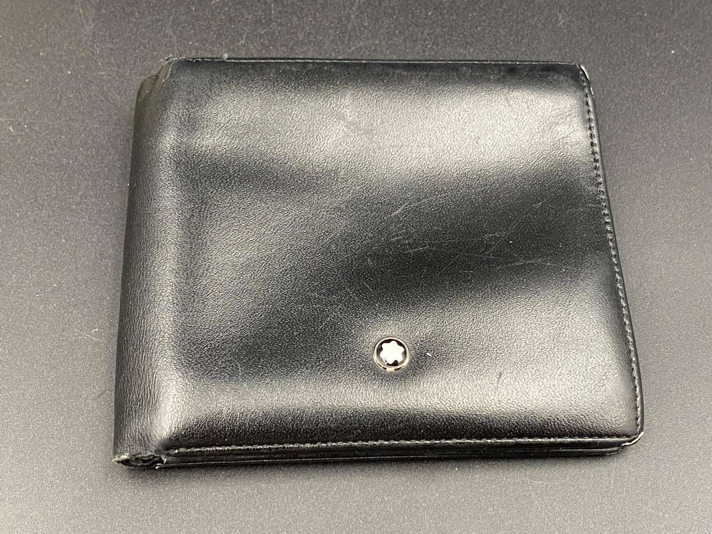 <p>MONT BLANC, a black leather wallet,</p>