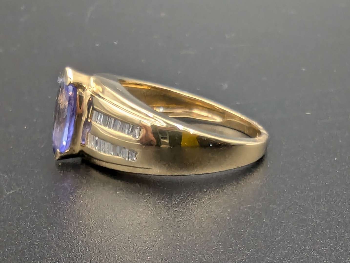 <p>Tanzanite and Diamond 14ct Gold Ring</p>