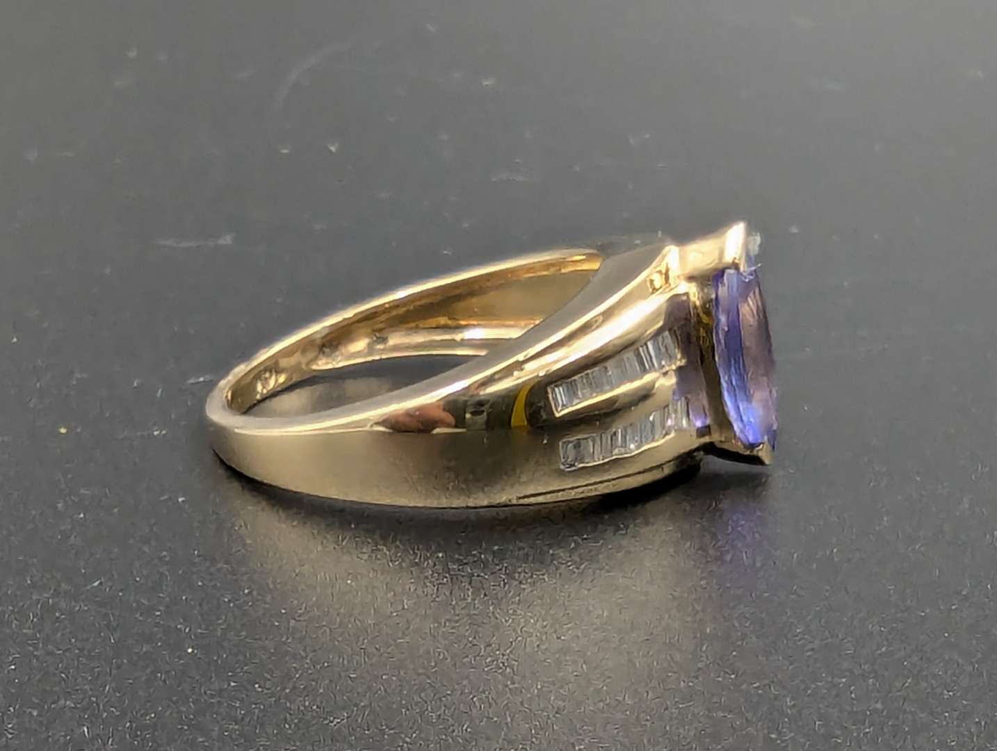 <p>Tanzanite and Diamond 14ct Gold Ring</p>