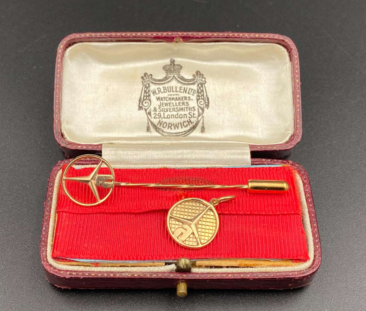 <p>MERCEDES-BENZ, unmarked yellow metal fob pendant and tiepin</p>