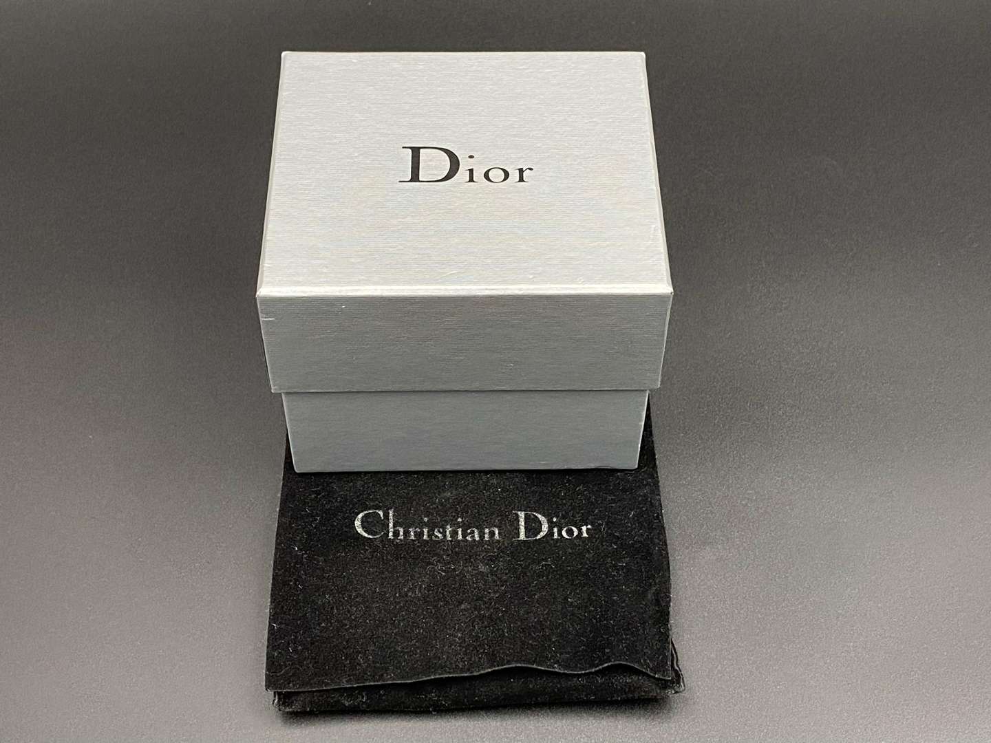 <p>CHRISTIAN DIOR, signed perspex and silvered studded cuff bracelet</p>