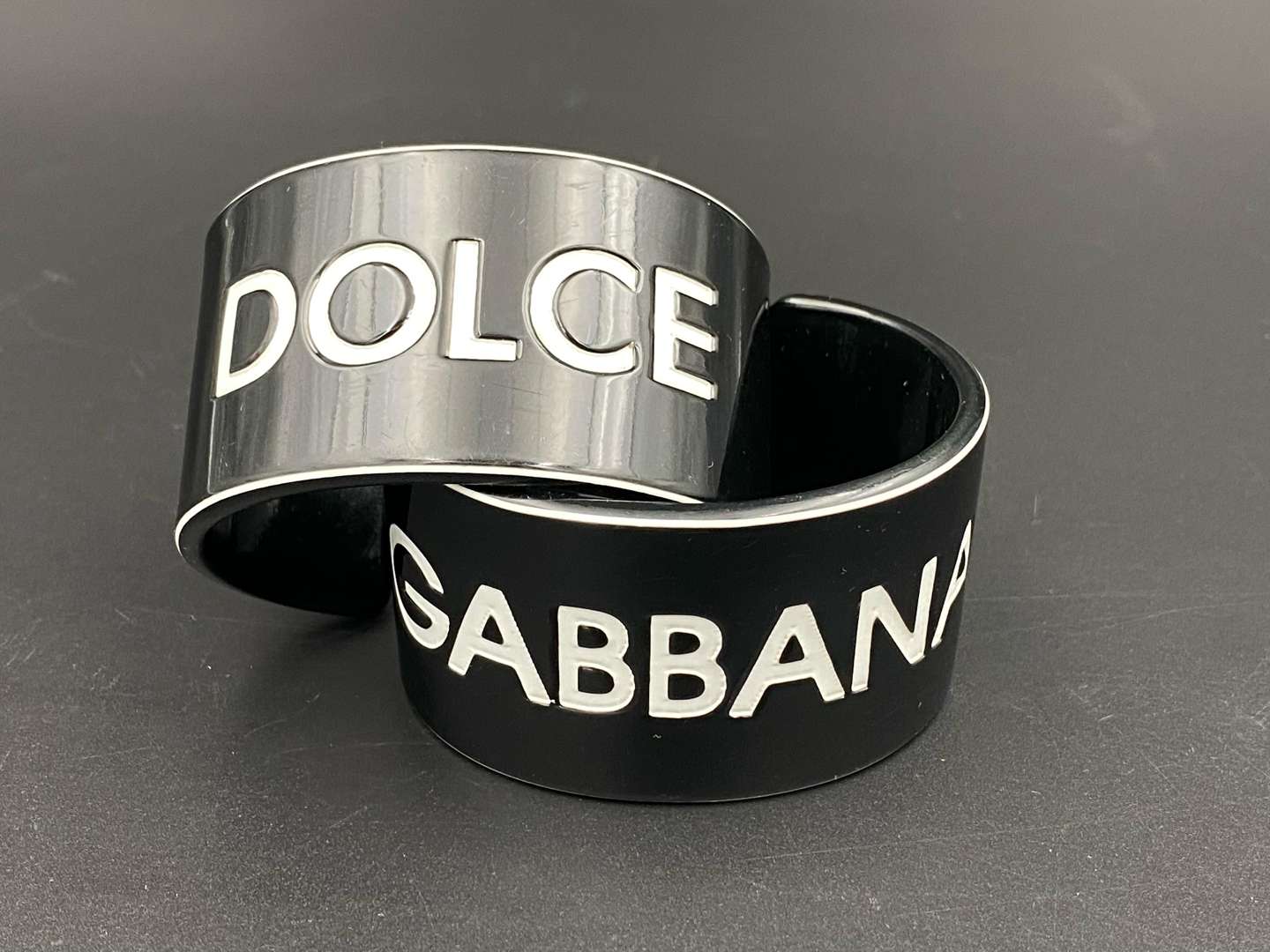 <p>DOLCE & GABBANA, a pair of vintage acrylic cuff bangles</p>