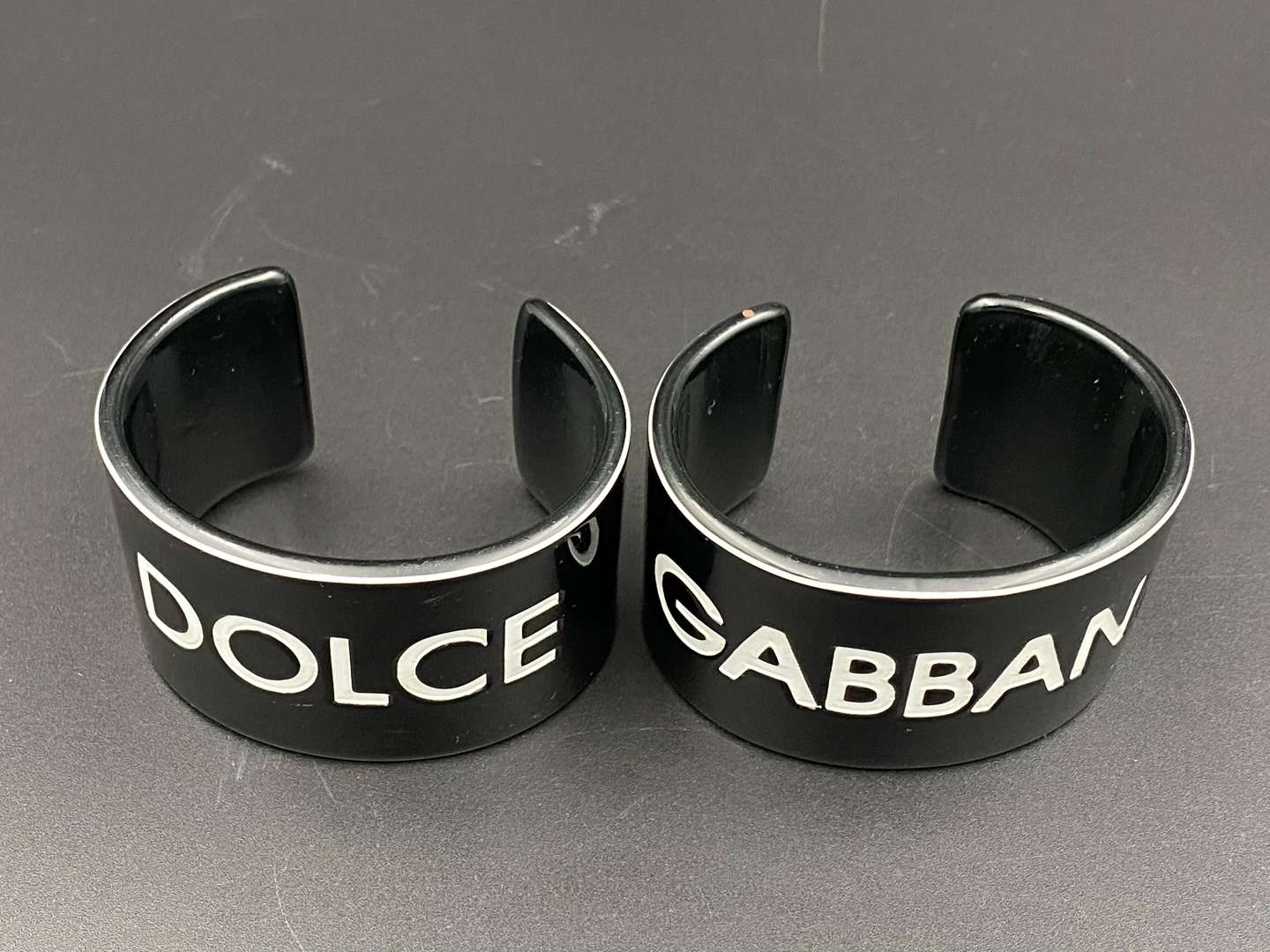 <p>DOLCE & GABBANA, a pair of vintage acrylic cuff bangles</p>