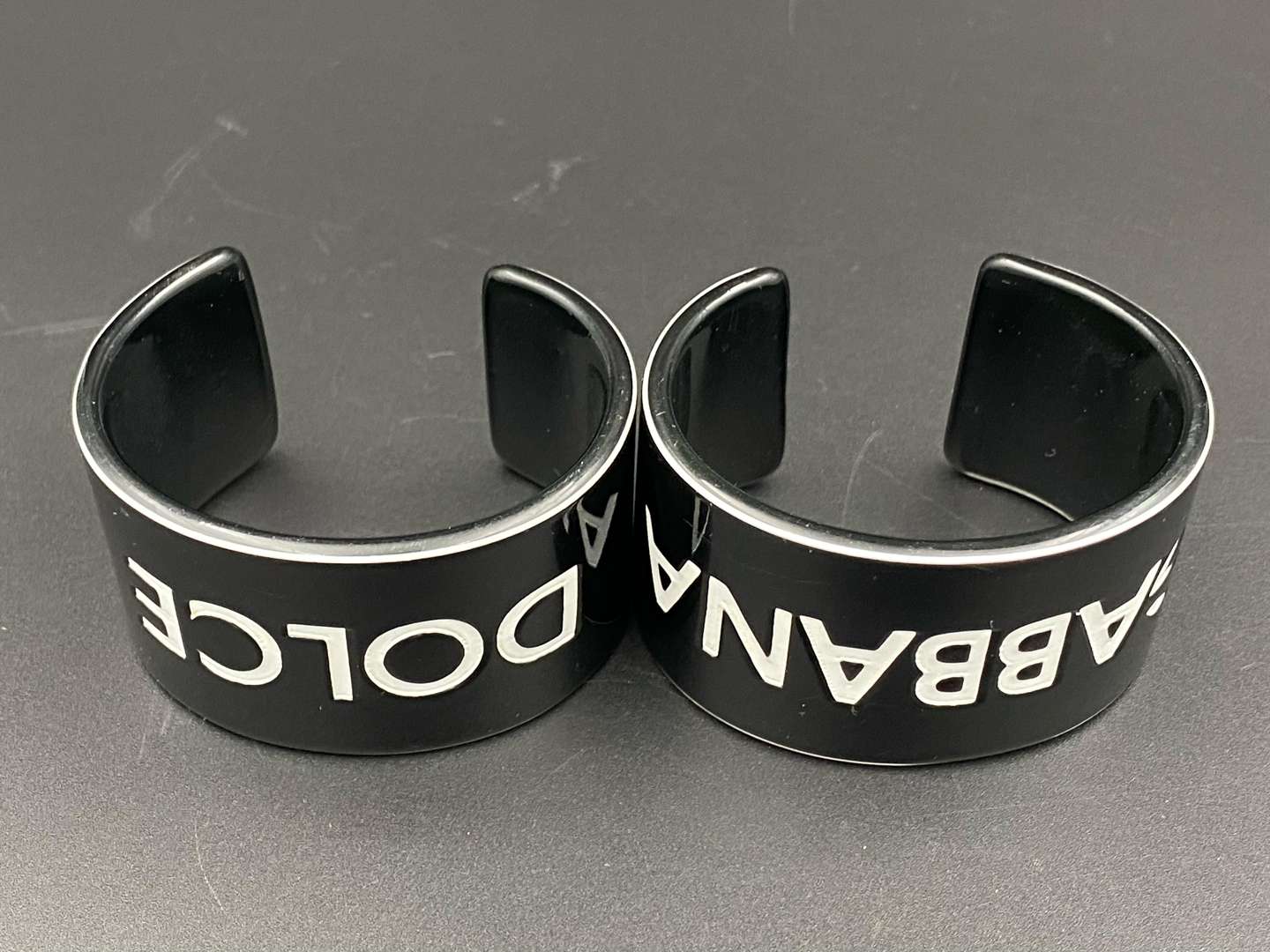 <p>DOLCE & GABBANA, a pair of vintage acrylic cuff bangles</p>