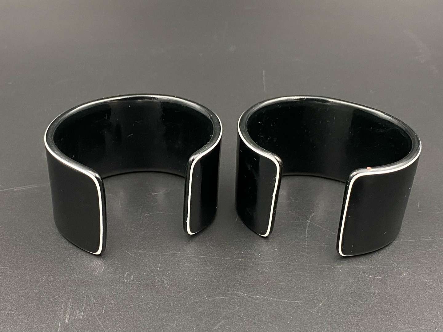 <p>DOLCE & GABBANA, a pair of vintage acrylic cuff bangles</p>