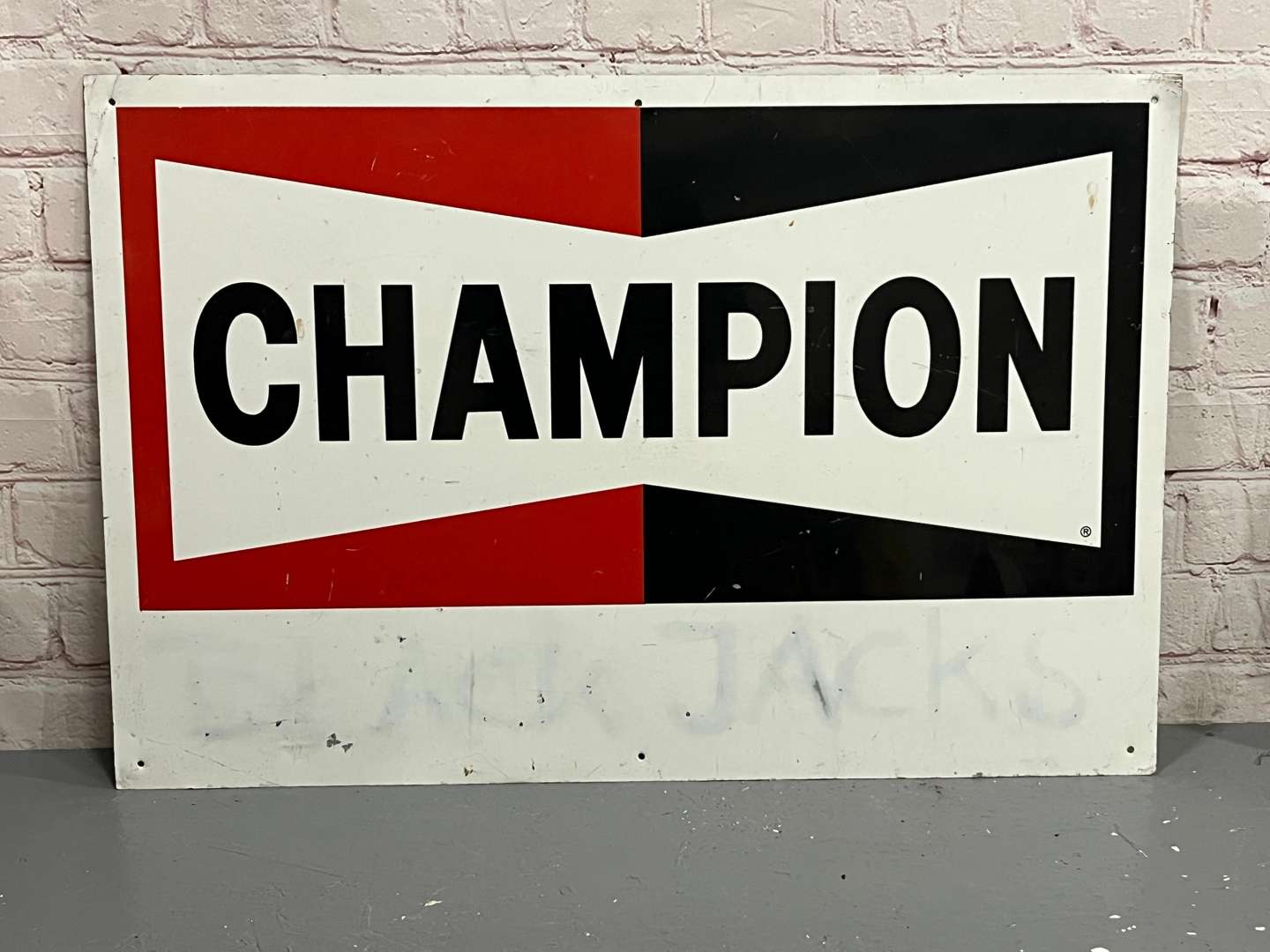 <p>Champion Spark Plug Tin Sign</p>