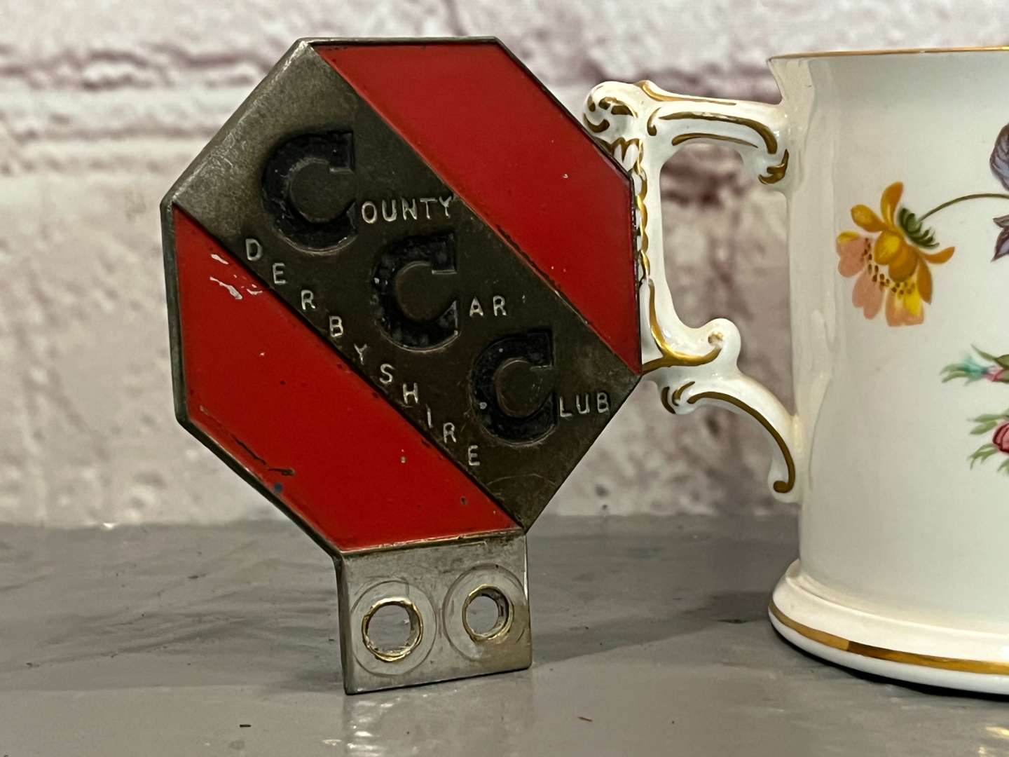 <p>Derby District Motor Club Mascot, Badge and Crown Derby Two Handled Mug (3)</p>