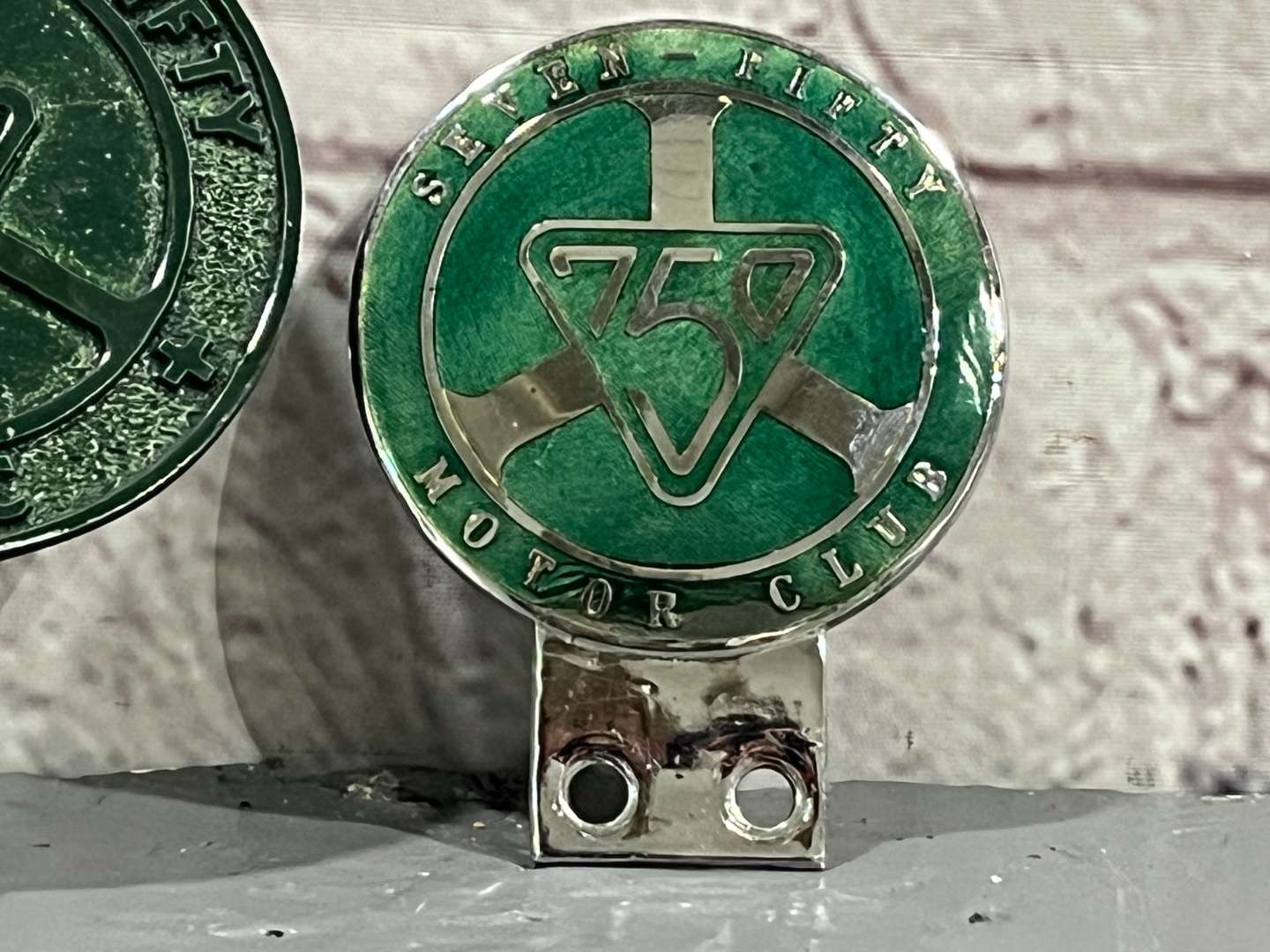 <p>Two 750 Motor Club Car Badges&nbsp;</p>