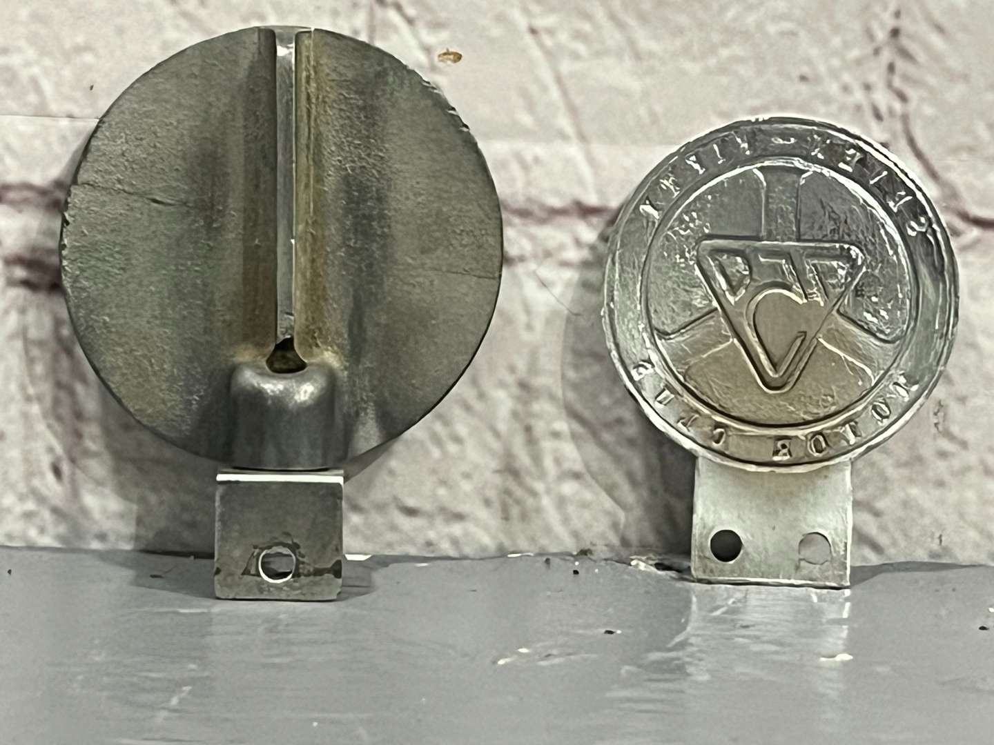 <p>Two 750 Motor Club Car Badges&nbsp;</p>