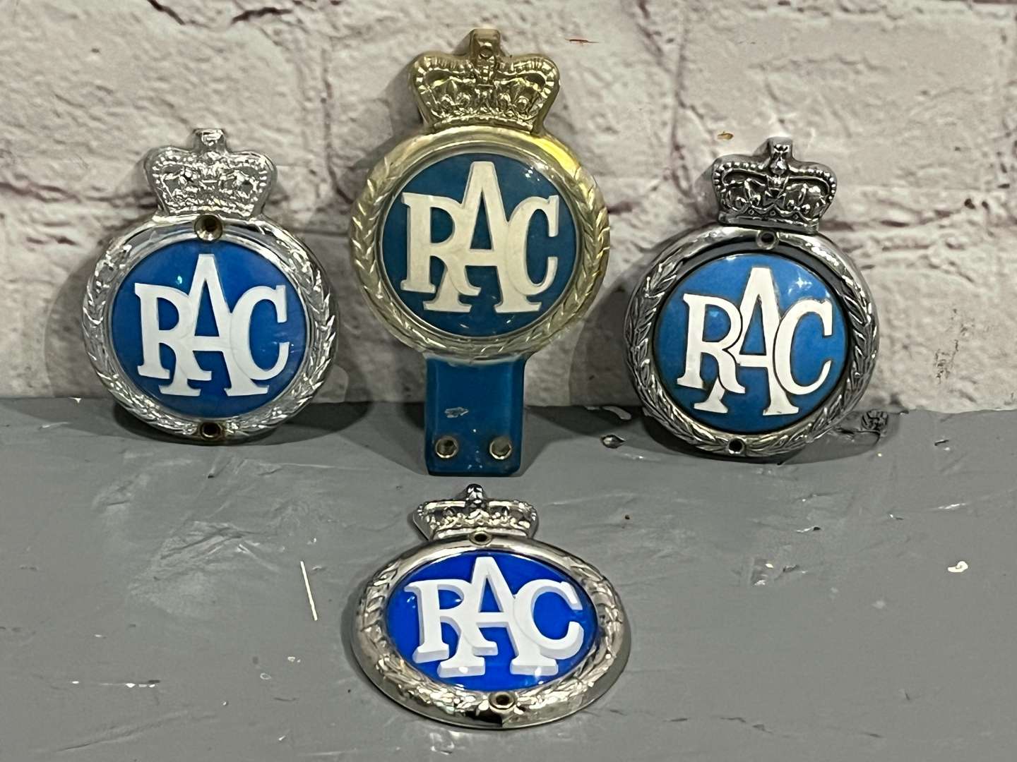 <p>Four Queen Elizbeth II RAC Badges&nbsp;</p>