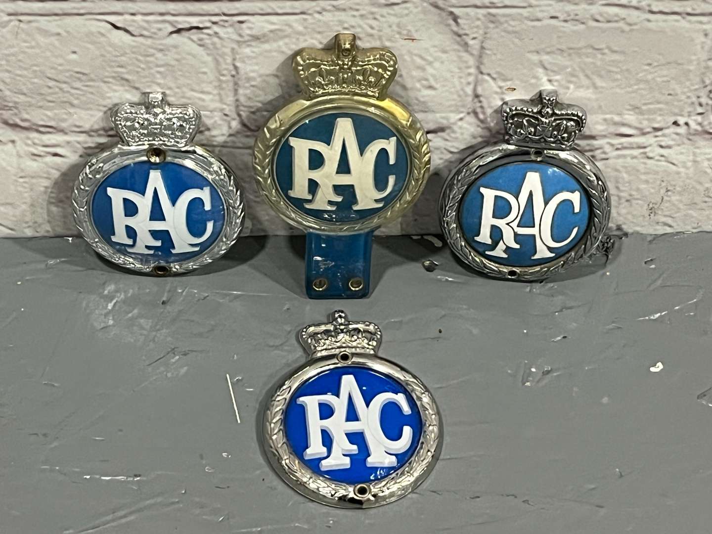 <p>Four Queen Elizbeth II RAC Badges&nbsp;</p>