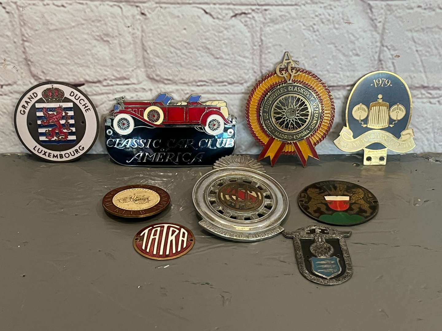 <p>Nine Enamel Classic Car Badges&nbsp;</p>