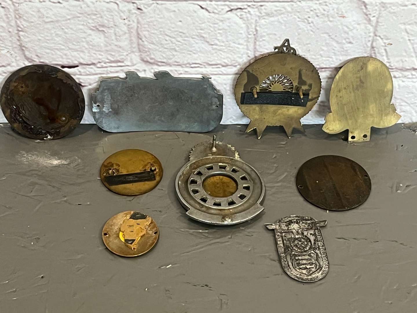 <p>Nine Enamel Classic Car Badges&nbsp;</p>