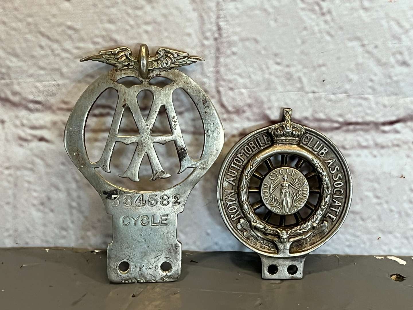 <p>Two Royal Automobile Club Associate Badge and AA Cycle Badge Numbered 384582</p>