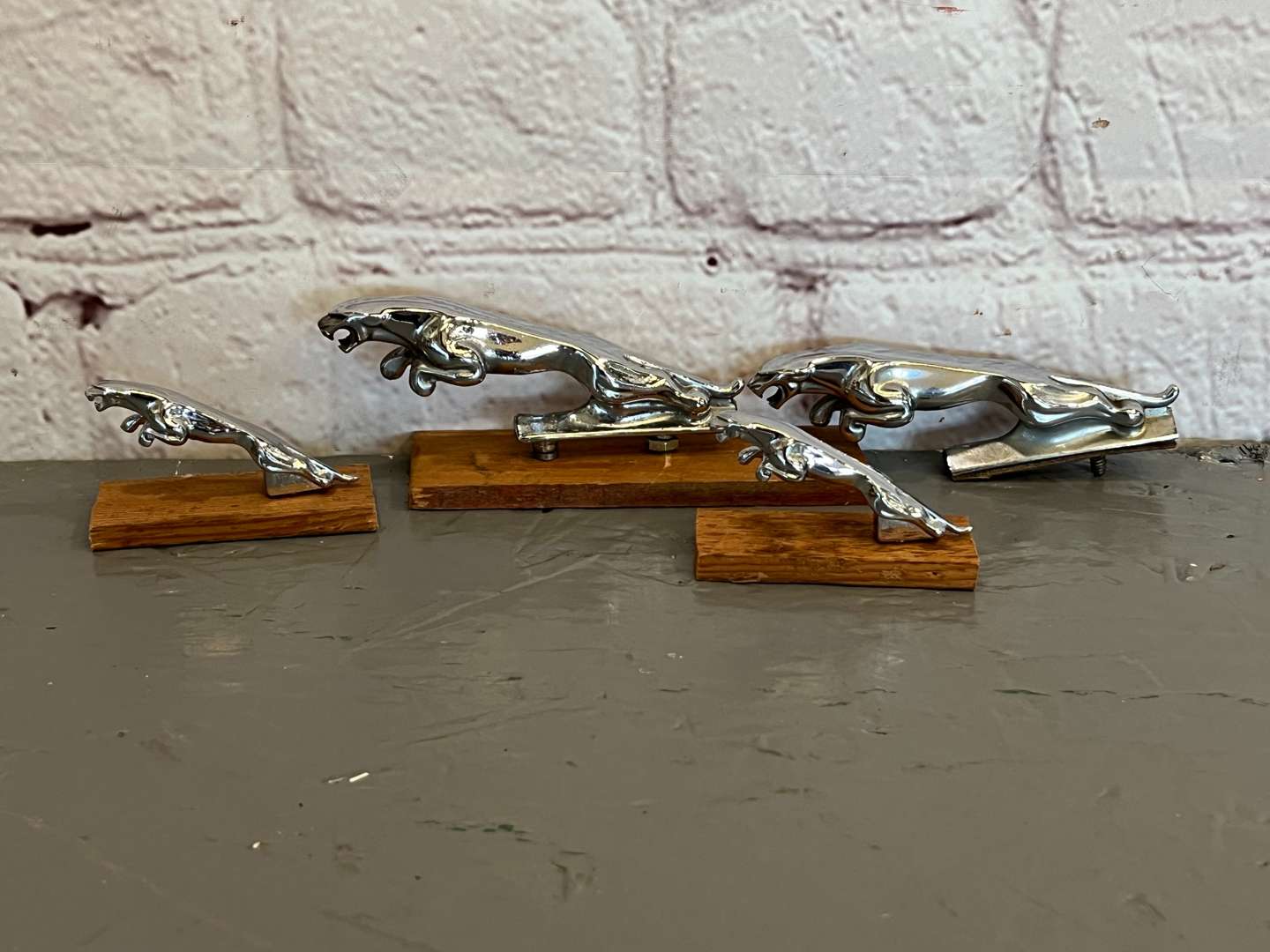 <p>Four Jaguar Small Leaping Car Mascots</p>