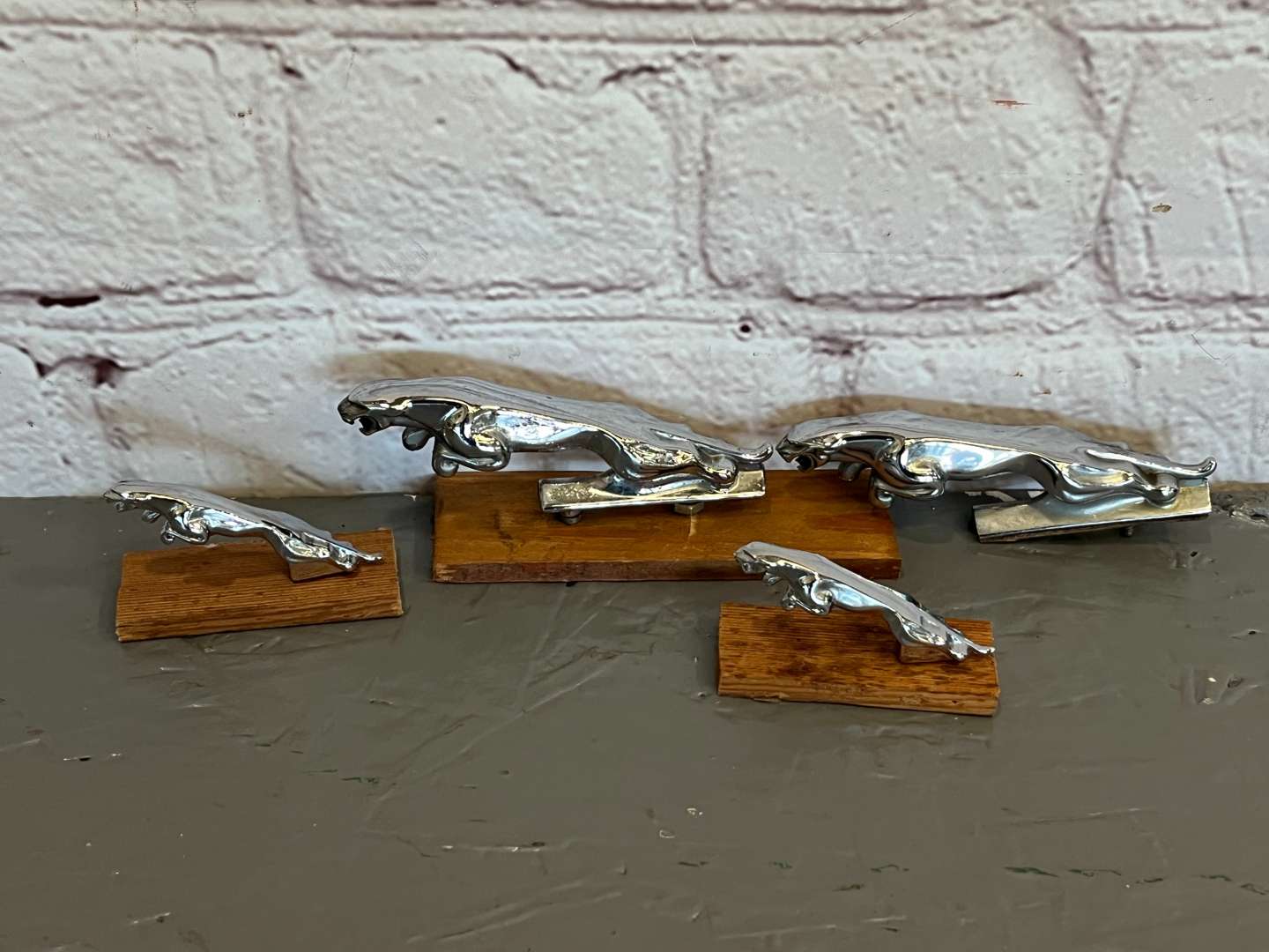 <p>Four Jaguar Small Leaping Car Mascots</p>
