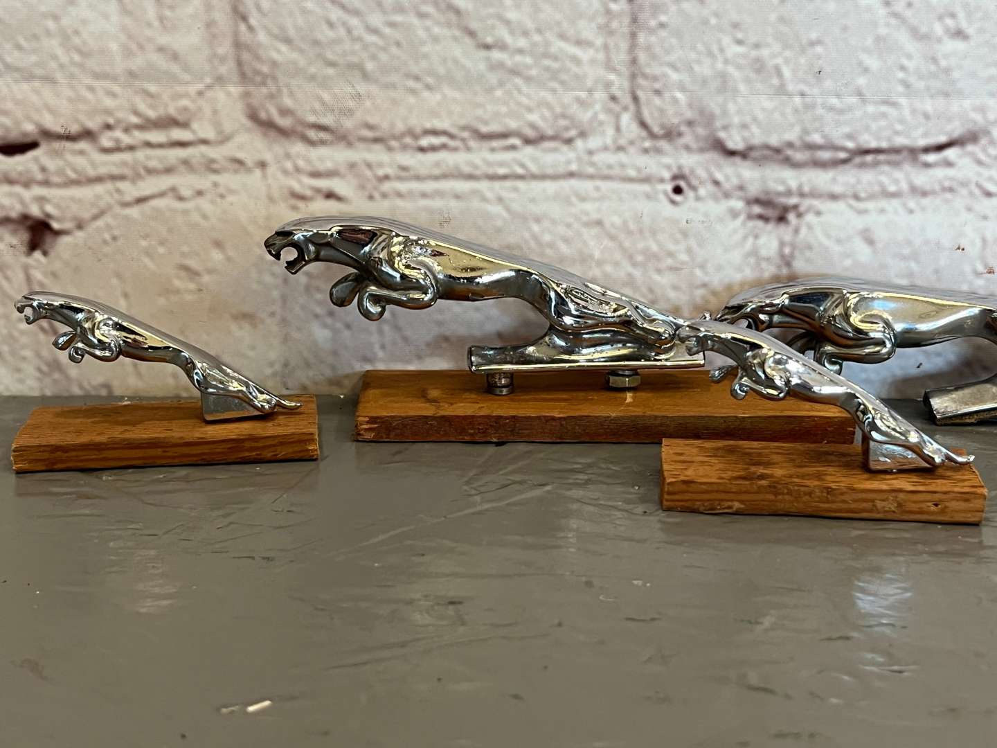 <p>Four Jaguar Small Leaping Car Mascots</p>
