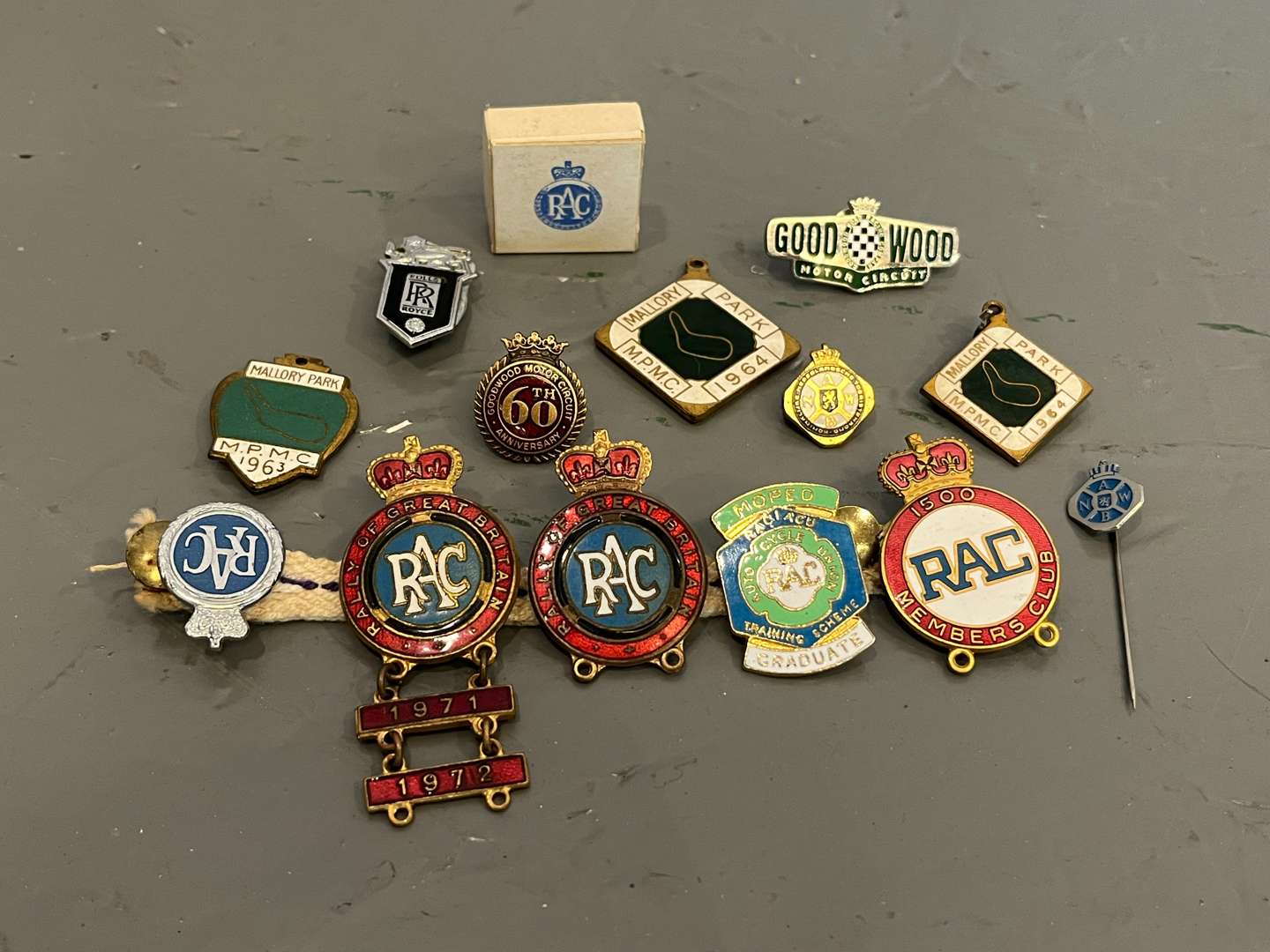 <p>Fourteen Goodwood/Mallory Park/RAC/ Rolls Royce Enamel Pin Badges&nbsp;</p>