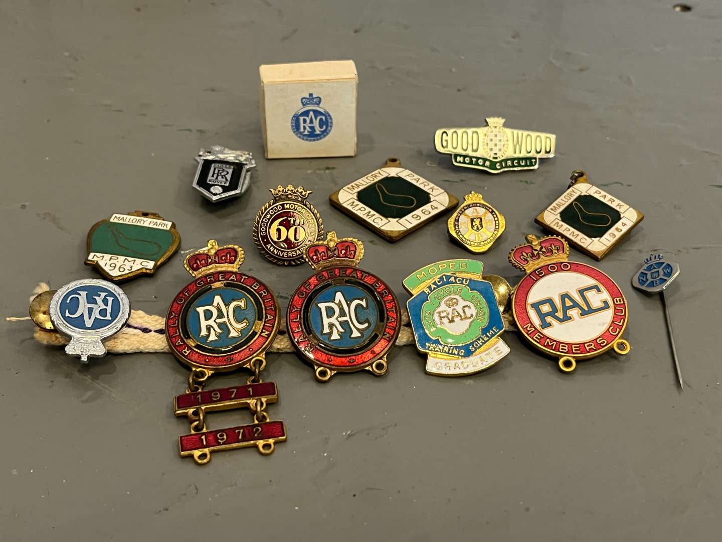 <p>Fourteen Goodwood/Mallory Park/RAC/ Rolls Royce Enamel Pin Badges&nbsp;</p>
