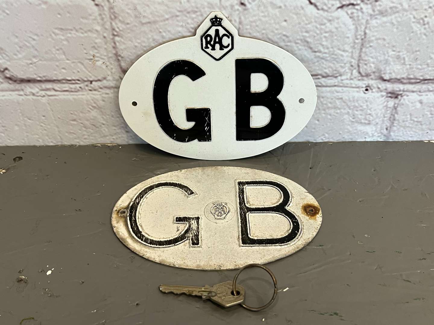 <p>Two Pressed Metal Commercial GB Badges</p>