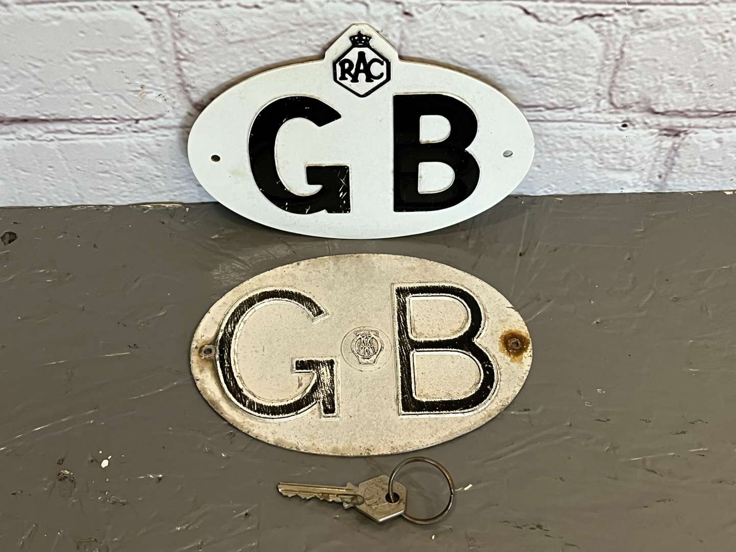 <p>Two Pressed Metal Commercial GB Badges</p>