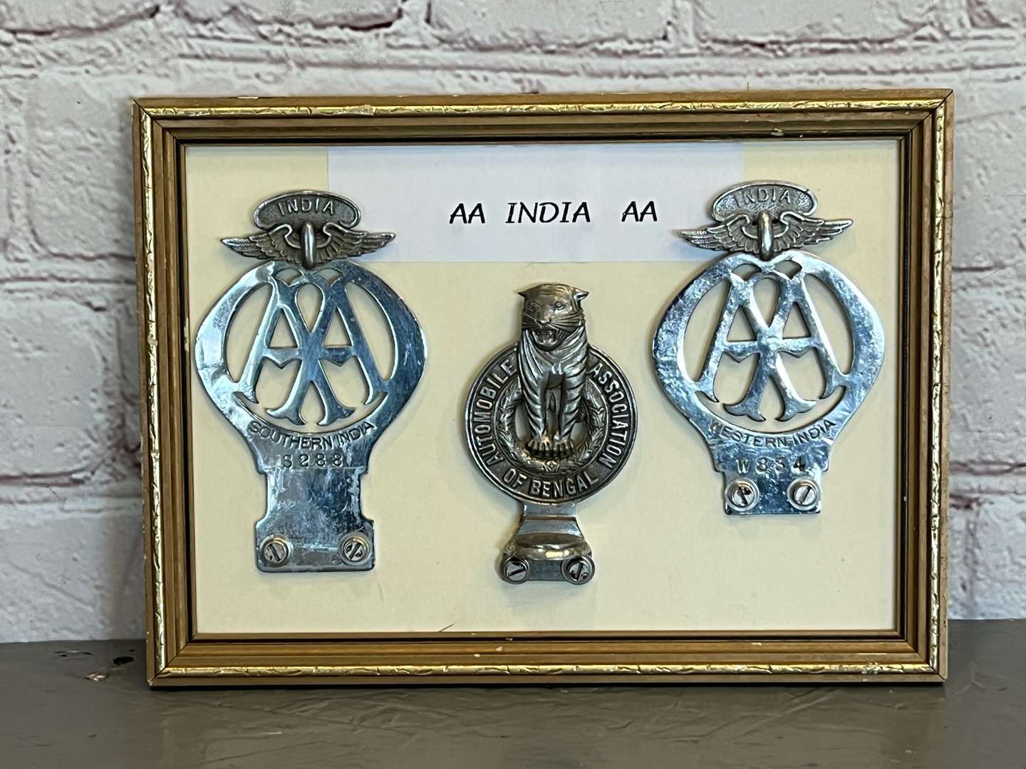 <p>Three Framed AA Indian Car Badges&nbsp;</p>