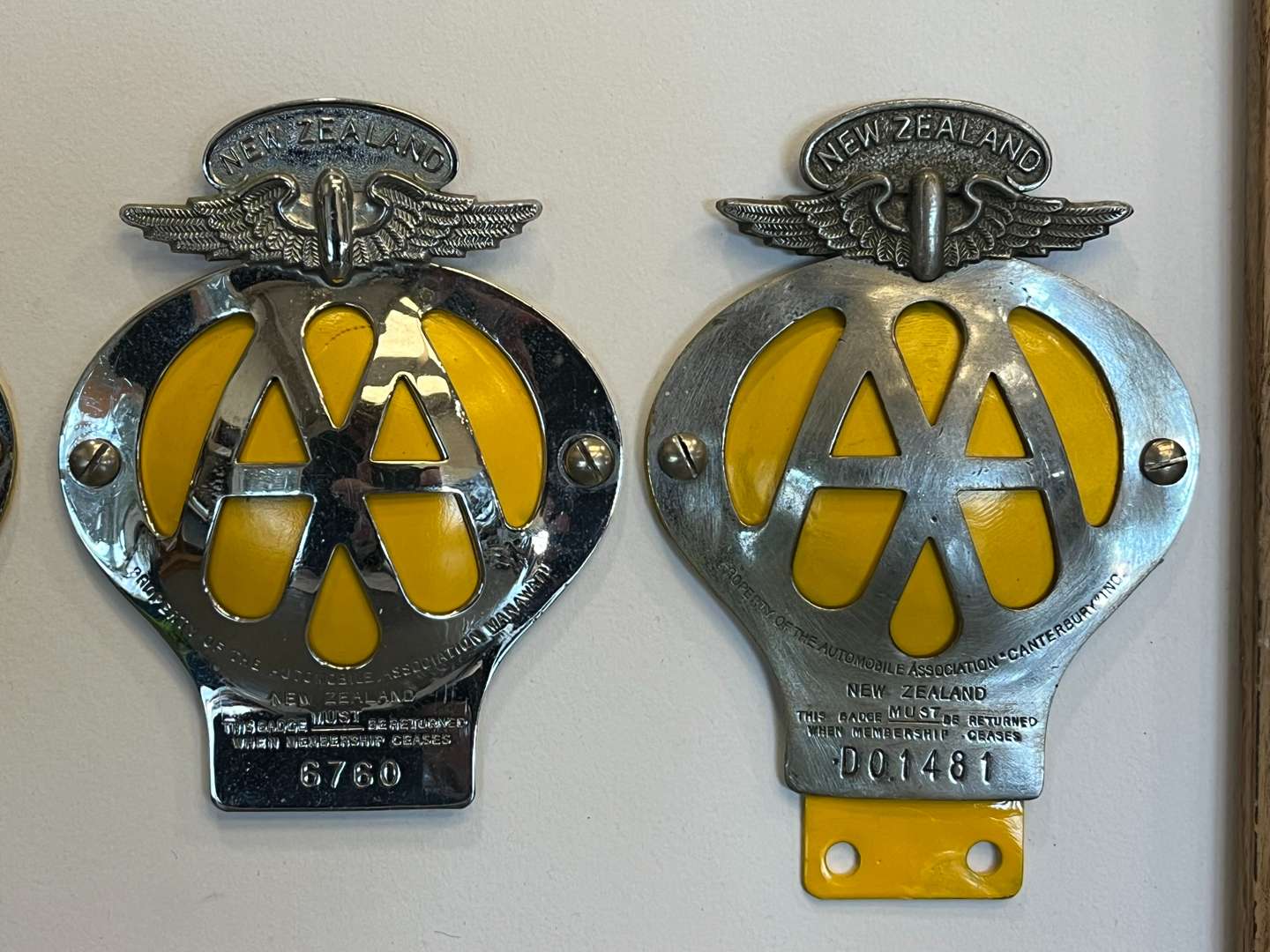 <p>Eight Framed AA Badges&nbsp;</p>