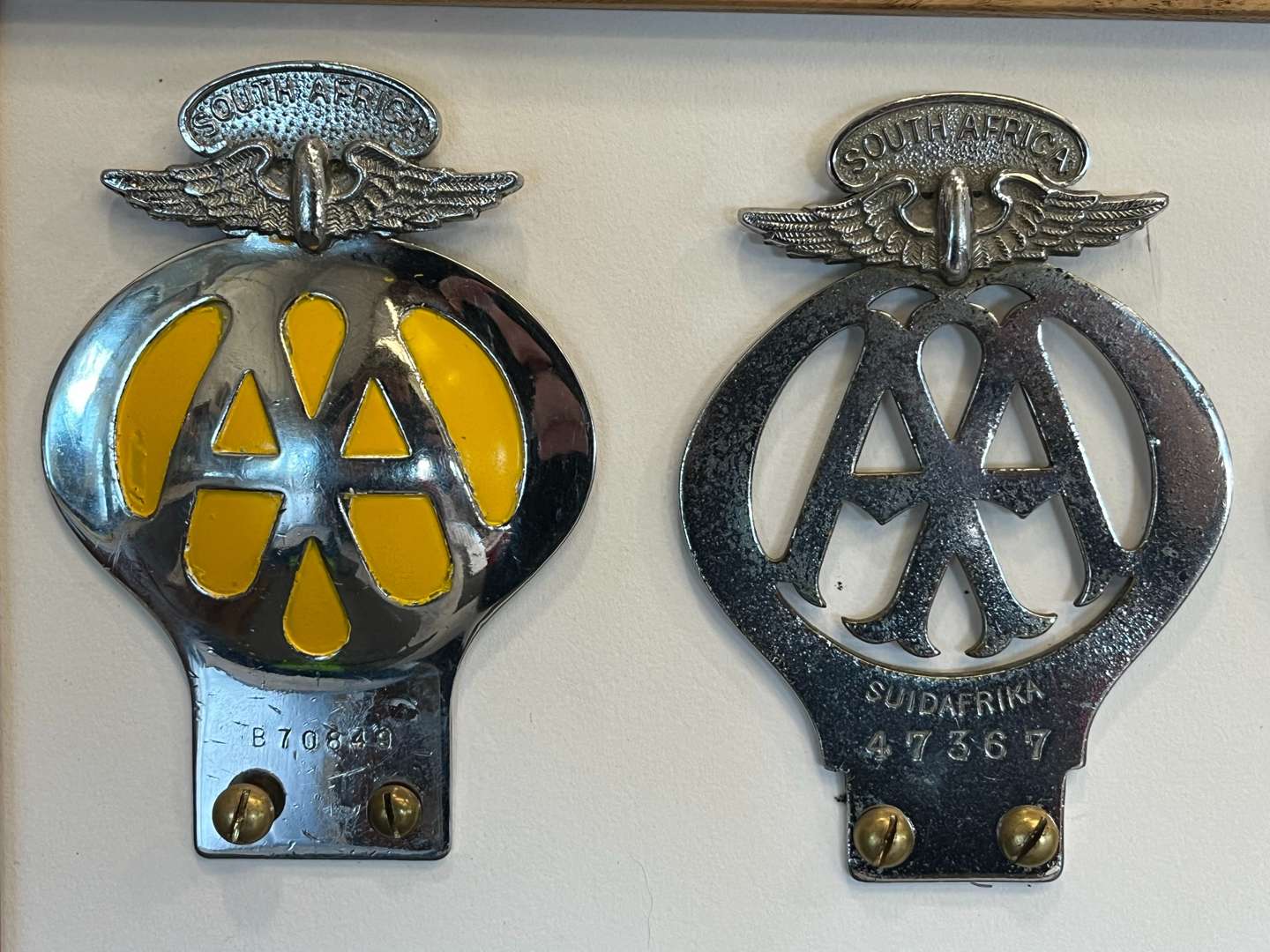 <p>Eight Framed AA Badges&nbsp;</p>