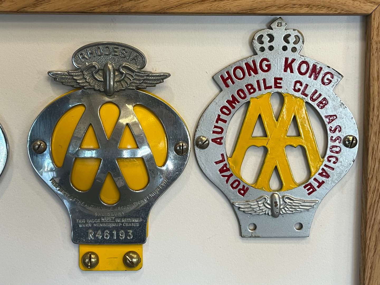 <p>Eight Framed AA Badges&nbsp;</p>