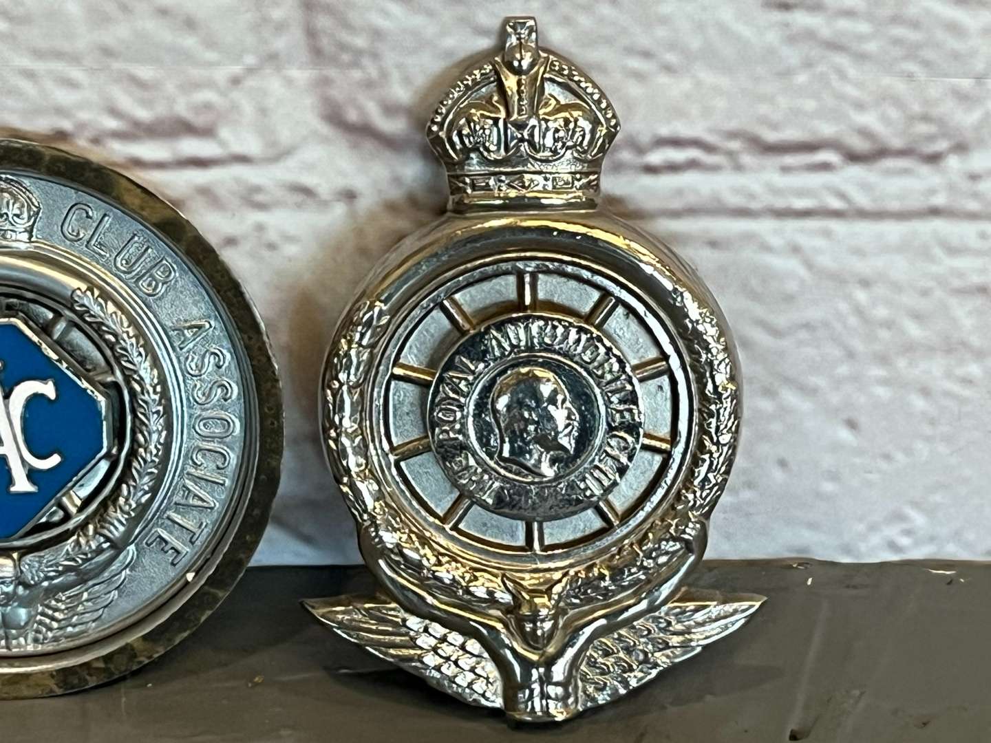 <p>Two RAC Car Club Badges</p>