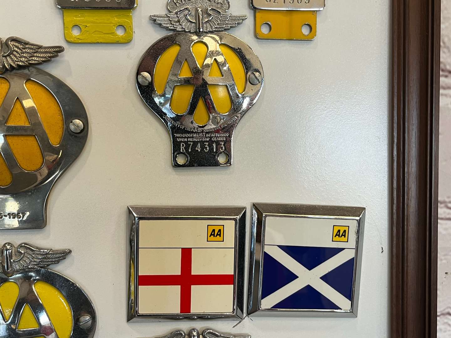 <p>Sixteen Framed Classic Car Badges&nbsp;</p>