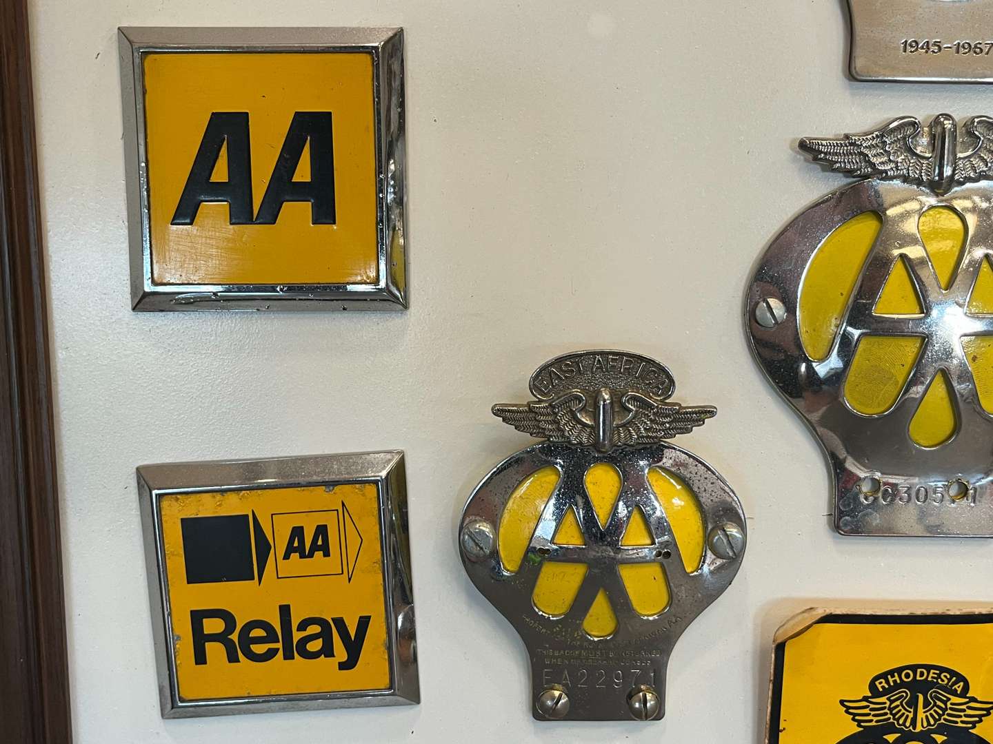 <p>Sixteen Framed Classic Car Badges&nbsp;</p>