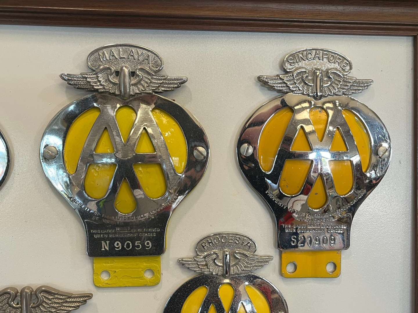 <p>Sixteen Framed Classic Car Badges&nbsp;</p>