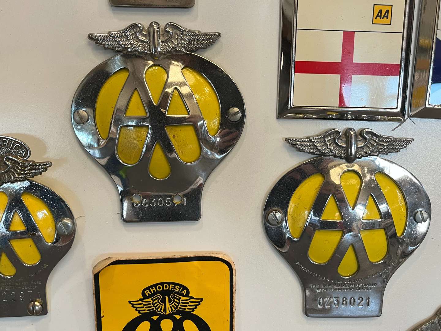 <p>Sixteen Framed Classic Car Badges&nbsp;</p>