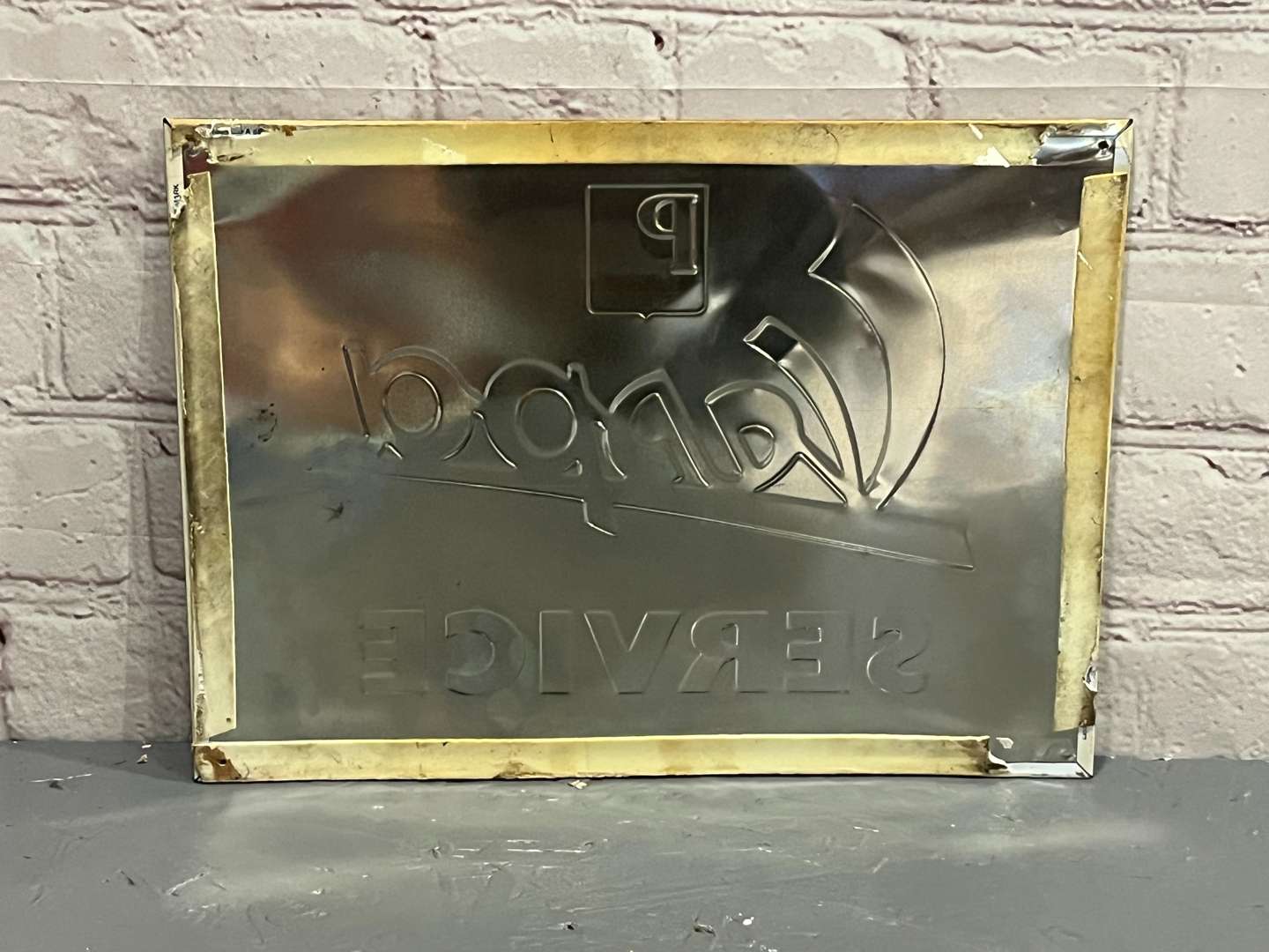 <p>Vespa Service Pressed Tin Sign</p>