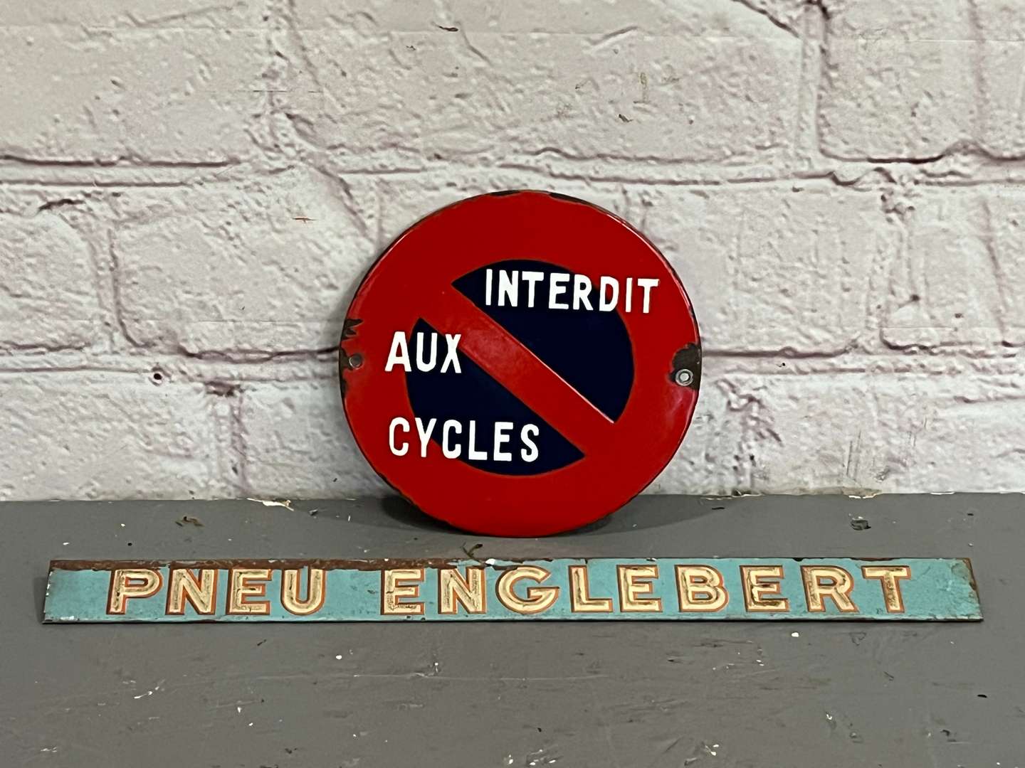 <p>French Cycles Sign and One Other</p>