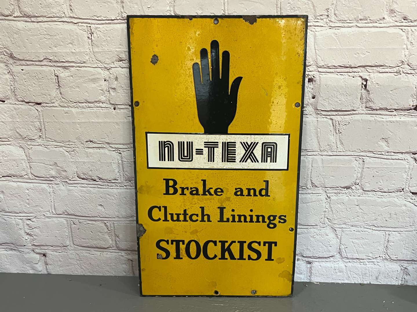 <p>NU-TEXA Brake and Clutch Lining Stockist Enamel Sign</p>