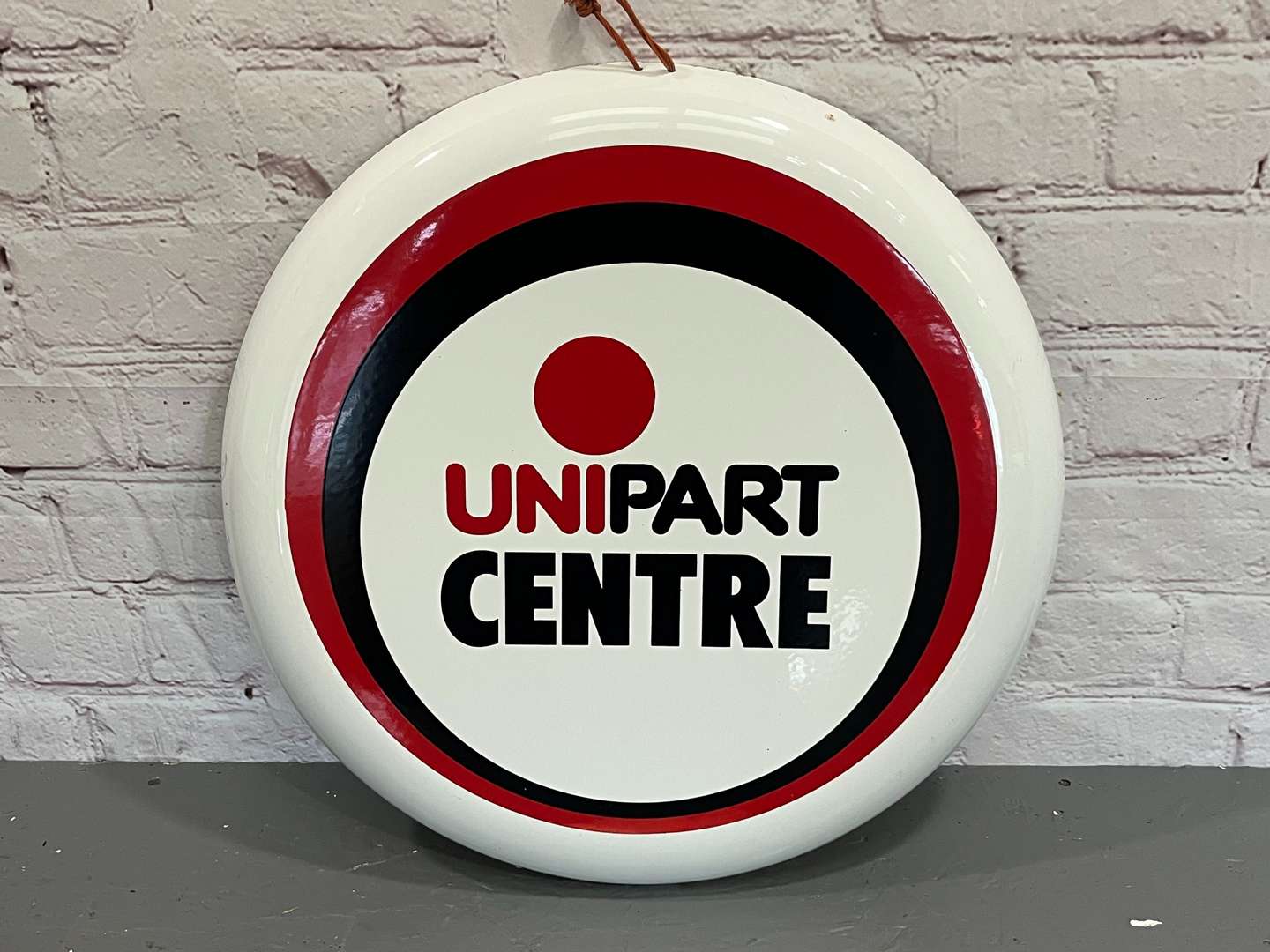 <p>Unipart Centre Convex Enamel Sign</p>
