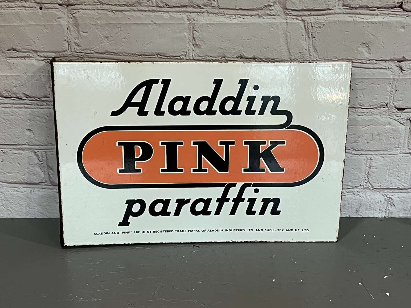 <p>Aladdin Pink Paraffin Enamel Flange Sign</p>