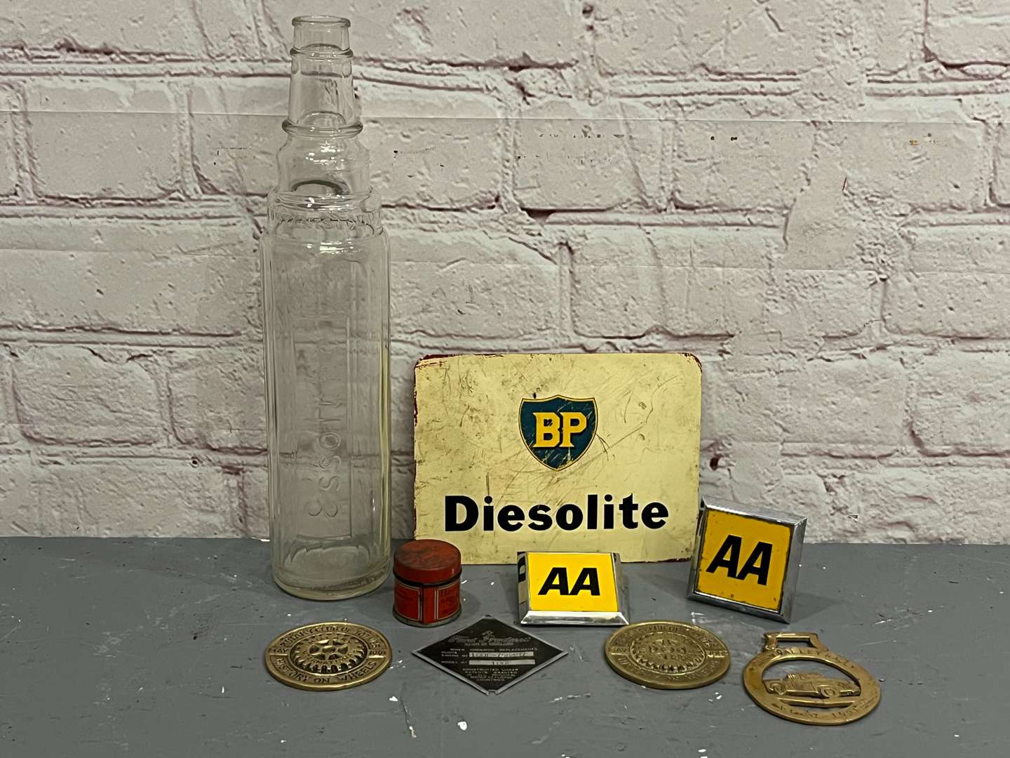 <p>Essolube Oil Bottle Quantity of Badges Etc</p>