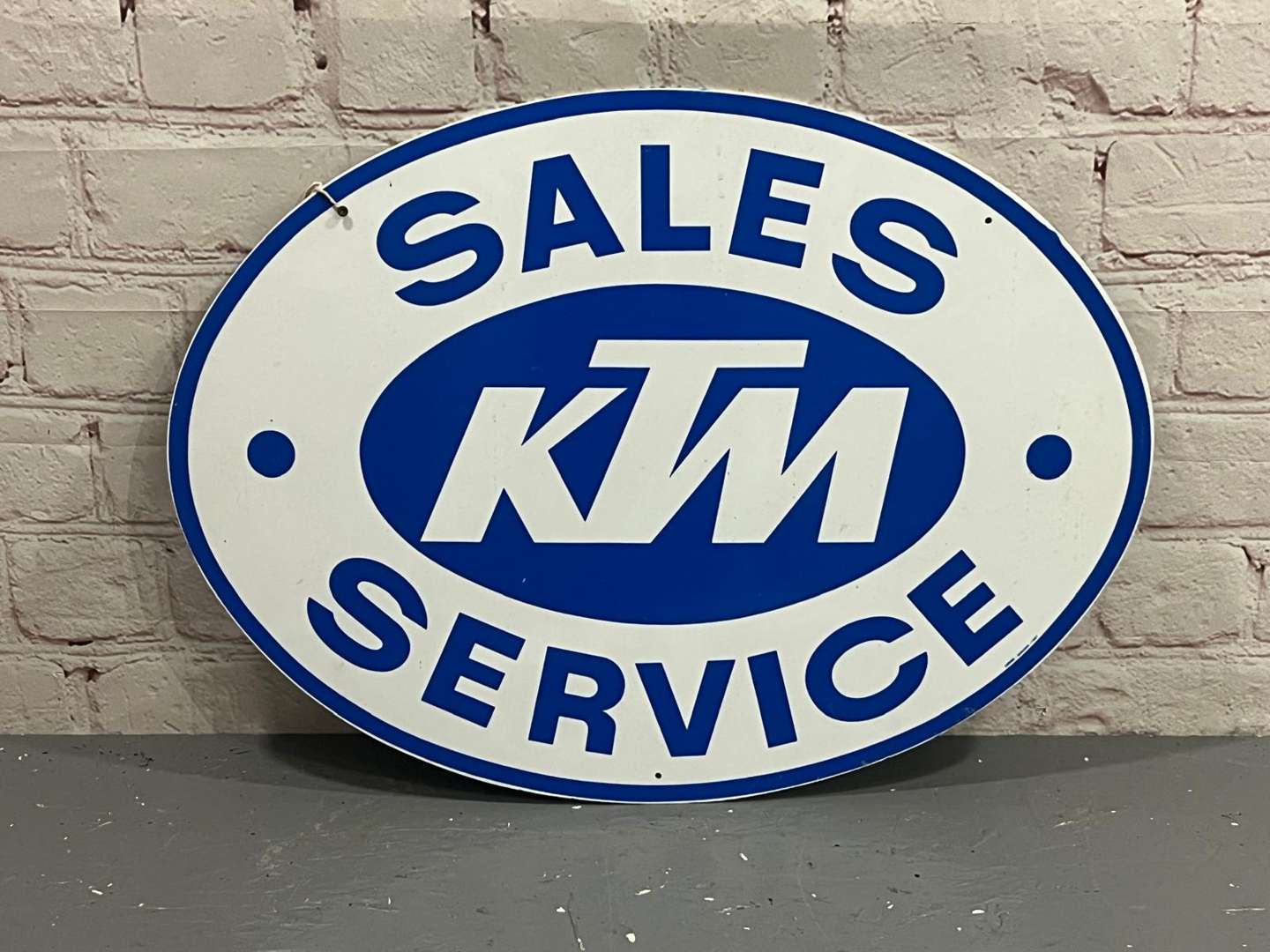 <p>KTM Sales and Service Plastic Oval Sign</p>