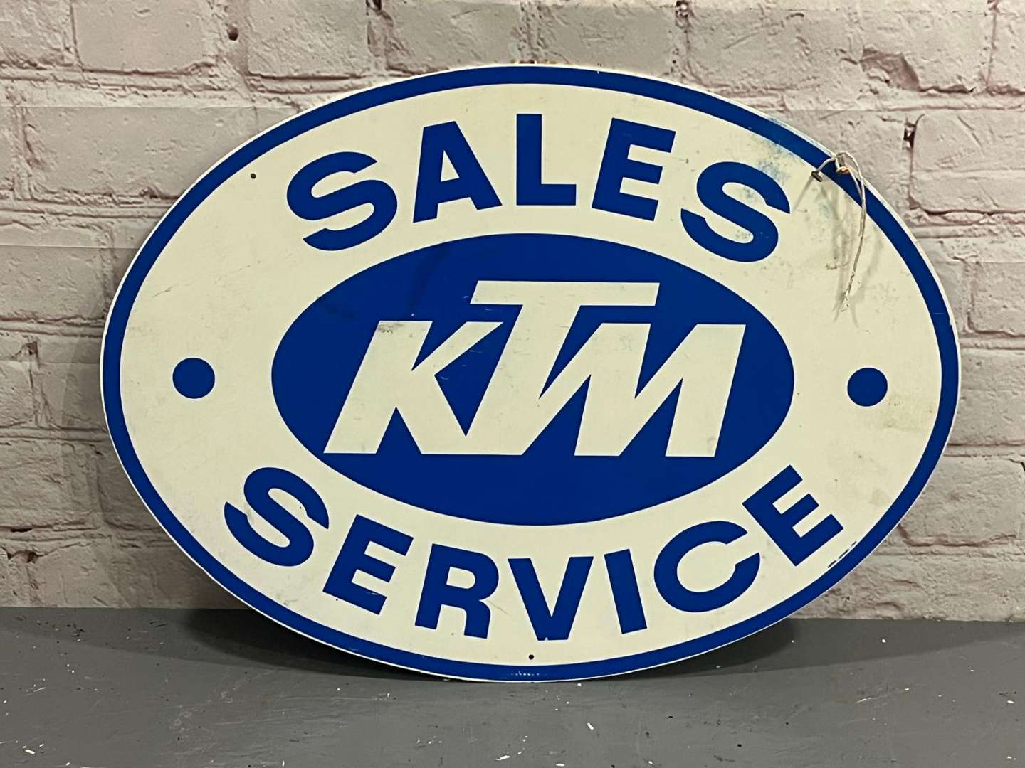 <p>KTM Sales and Service Plastic Oval Sign</p>
