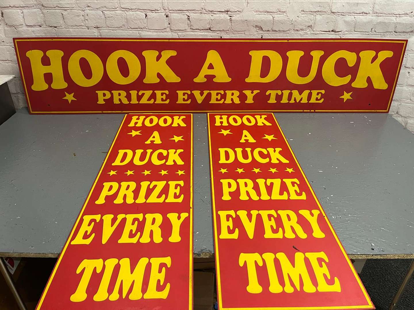 <p>Three Fairground “Hook a Duck” Signs on Plastic Board</p>